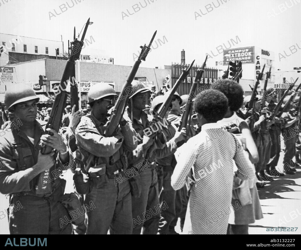Berkeley, California:  May, 1969 African American women confront black National Guardsmen called in by Ronald Reagon to quell the People's Park protests.