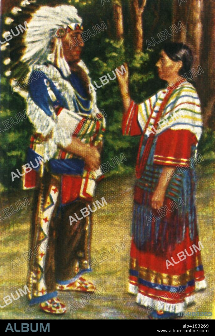 Native American couple, c1928. Chief wearing eagle-feather bonnet, and his wife. From "Die Welt in Bildern", (The World in Pictures), cigarette card album, c1928. [Georg A Jasmatzi, A.-G., Dresden, Germany].
