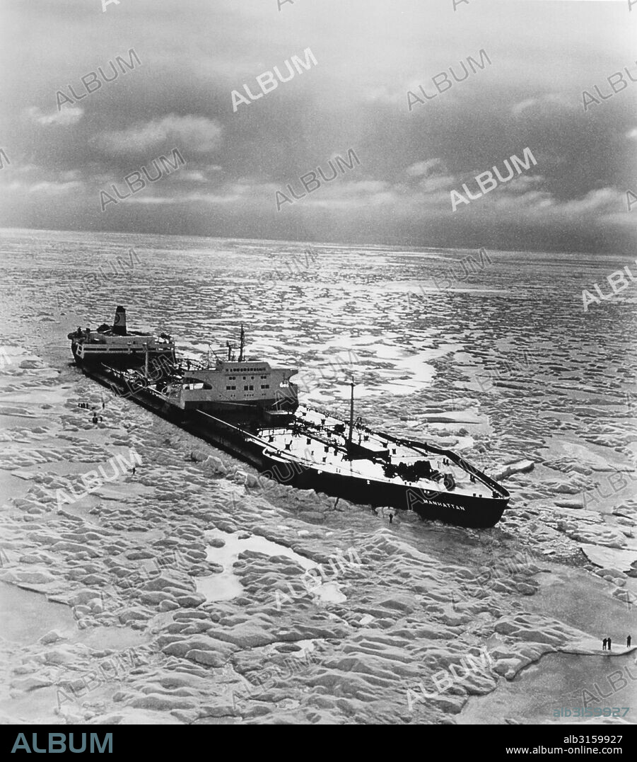 Canada: November, 1969 The SS Manhattan, an oil tanker outfitted with an icebreaker bow, as she crosses the Northwest Passage in the Arctic. The ship is 1005 feet long, and its beam was increased form 132 feet to 148 feet by the addition of a protective 'ice belt' to guard against hull penetration by the icebergs encountered on the expedition. The icebreaking bow added 65 feet to her length.