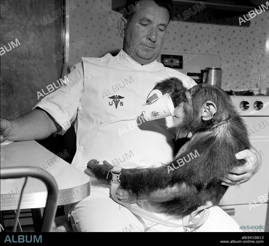 Enos with his handler drinking from cup. Enos (d. November 4, 1962) was the 2nd chimp launched into space and the first chimp to achieve Earth orbit. Enos' flight occurred on November 29, 1961. His training was more intense for him than for his predecessor Ham, because Enos was exposed to weightlessness and higher gs for longer periods of time. His training included psychomotor instruction and aircraft flights. Enos died of shigellosis-related dysentery, which was resistant to then-known antibiotics. Pathologists reported no symptoms that could be attributed or related to his space flight.
