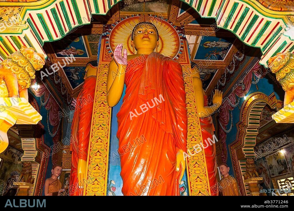 Statue in the old Buddhist temple complex of Sri Pushparama Maha Viharaya, near Balapitiya, Welitara Region, Southern Province, Sri Lanka