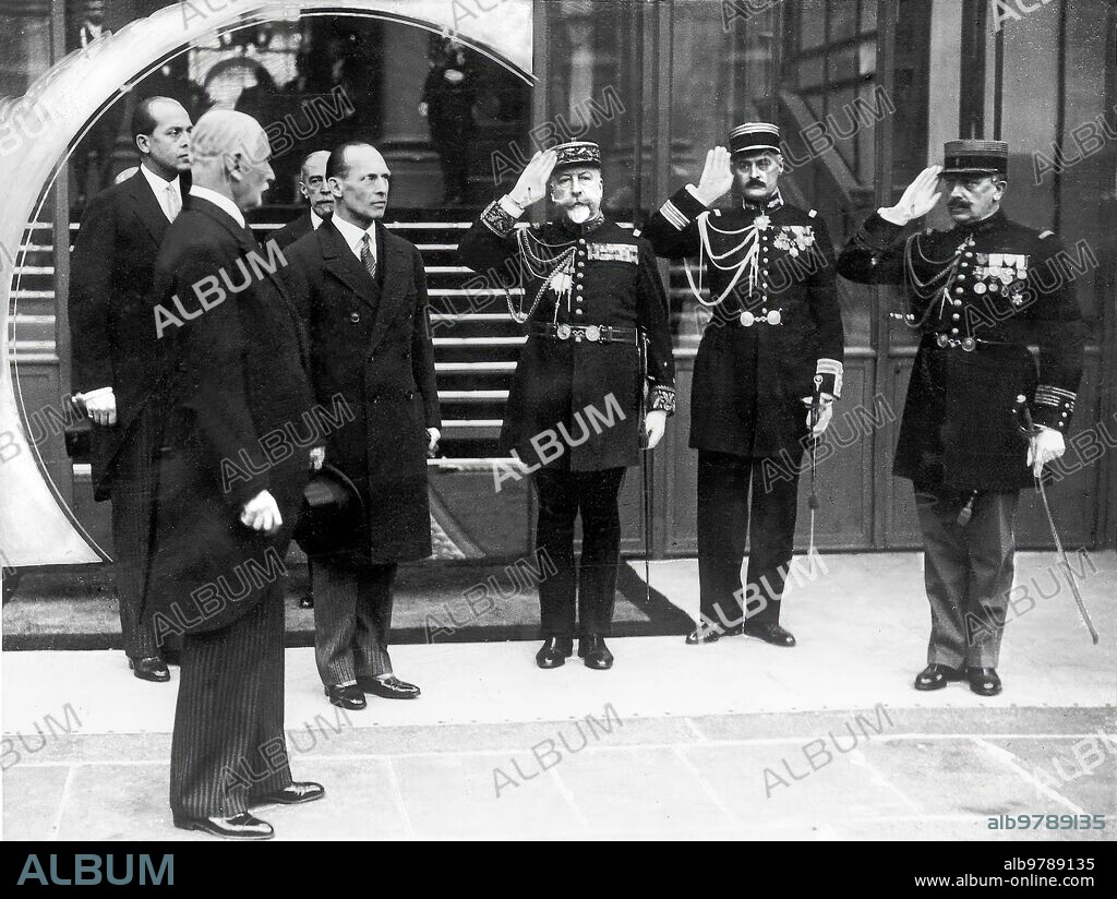February 15, 1935. King George II of Greece on a trip to France, at the Elysée, leaving the presidential residence accompanied by General Braconnier and Colonel Brosse.