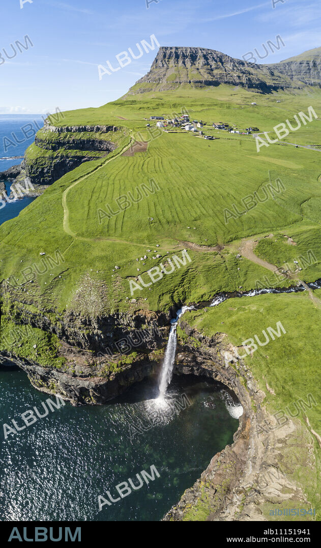 Panoramic of cliffs and Mulafossur Waterfall, Gasadalur, Vagar Island, Faroe Islands, Denmark, Europe.