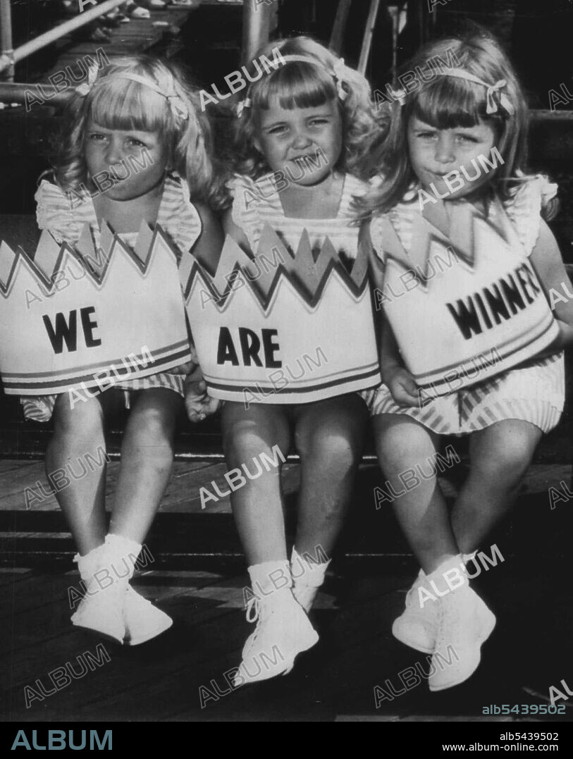 'Most Photogenic' -- Alice, Barbara and Carol Rogers, three and one-half-year-old triplet daughters of Mrs. Marion Rogers, East Port Chester, N.Y., hold their "crowns" after winning first prize as most photogenic of 24 triplets at the Mothers of Triplets Association convention here yesterday. August 28, 1946. (Photo by AP Wirephoto).