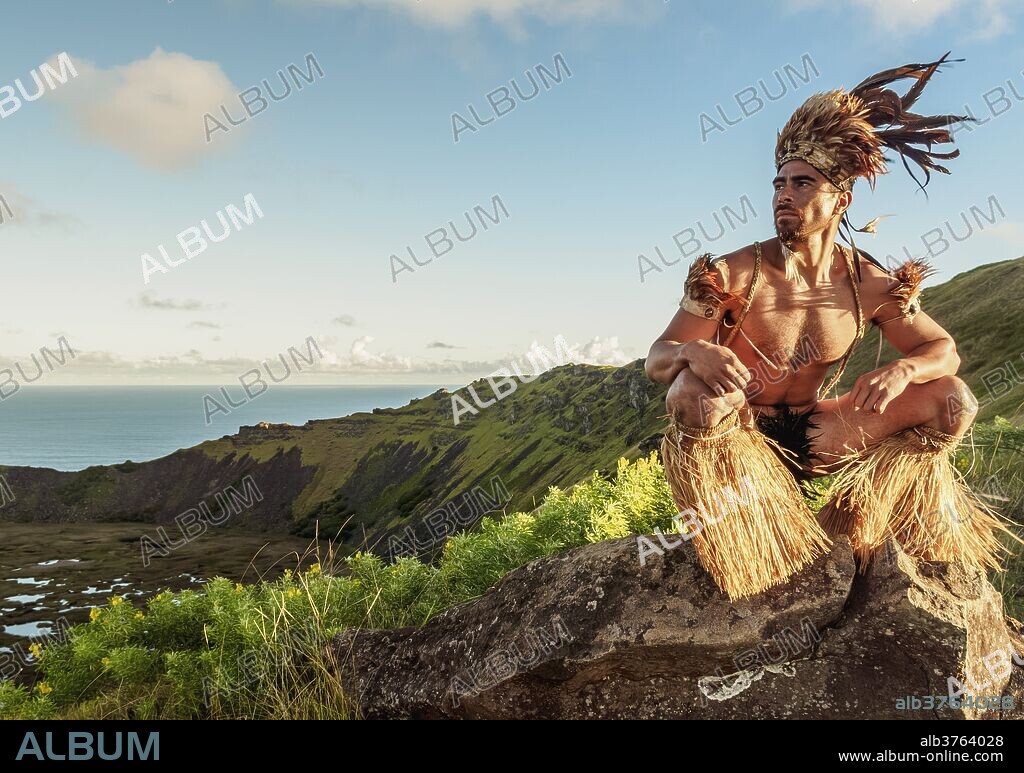 Native Rapa Nui man in tradititional costume on the rim of the Rano Kau Volcano, UNESCO World Heritage Site, Easter Island, Chile, South America.