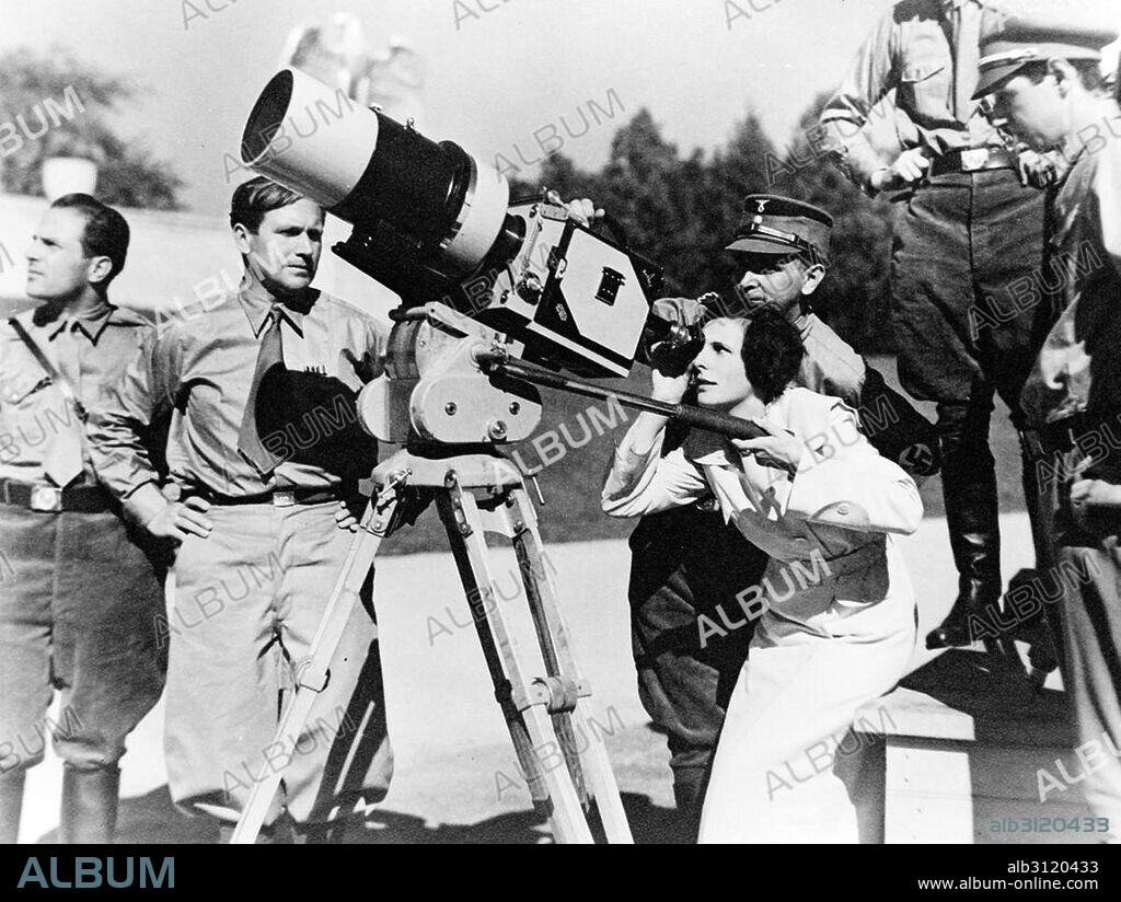 Photograph of Leni Riefenstahl (1902-2003) German film director, producer, screenwriter, editor, photographer, actress and dancer. Riefenstahl looks through the lens of a large camera prior to filming the 1934 Nuremberg Rally in Germany. Dated 1934.
