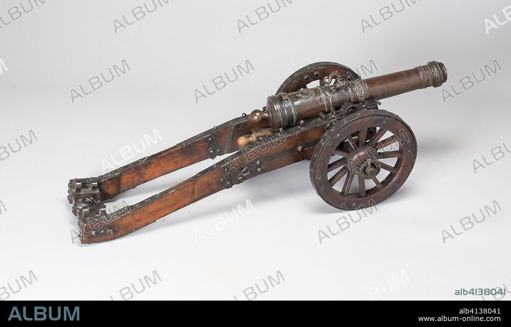 Model Field Cannon with Carriage and Wedge. Austrian, possibly Dutch. Date: 1682. Dimensions: Overall length of cannon: 22 11/16 in. (58 cm)
Cliber: 1 1/4 in. (3.2 cm)
distance between ends of trunnions: 5 3/8 in. (13.7 cm)
Weight: 37 lb. 14 oz.

Length of carriage: 33 3/8 in. (84.8 cm)
Distance between muzzle end of cannon and end of trail: 42 11/16 in. (108.5 cm)
Diameter of wheels: 11 3/4 in. (29.9 cm)
Distance between outside surfaces of hubs: 14 13/16 in. (37.6 cm)
Width of cheek end: 5 1/8 in. (13 cm)
Width of trail end: 8 5/8 in. (22 cm)
Weight of carriage: 22 lb. 4 oz. Bronze, wood, and iron. Origin: Austria.