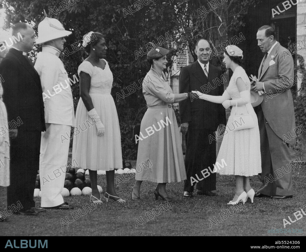 Princess Margaret, escorted by Gov. Sir Hubert Rance, right, is greeted by Trinidad residents during garden party in Port of Spain, Feb. 2. February 04, 1955. (Photo by Associated Press Photo).