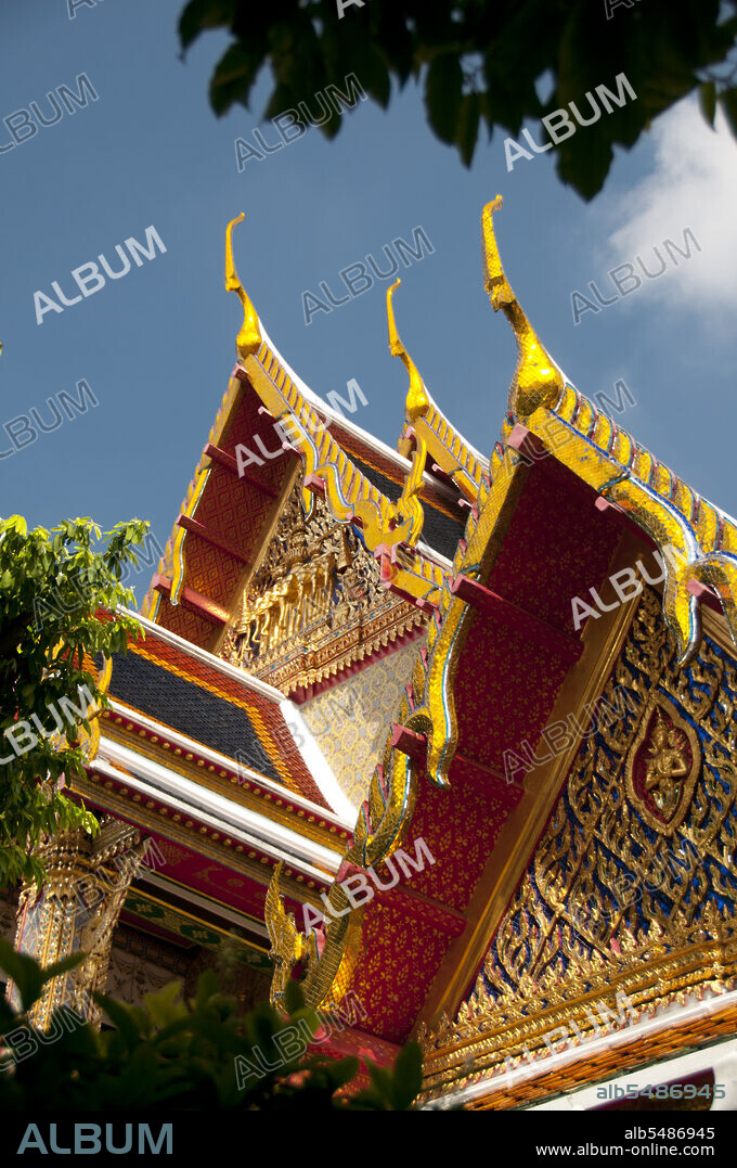 Chofah (sky tassel) are Thai architectural decorative ornaments that adorn the top end of Buddhist temple and some palace roofs in Thailand, Cambodia, Laos, and Myanmar. It resembles a tall thin bird and looks hornlike. The chofah is generally believed to represent the mythical creature Garuda, half bird and half man, who is the vehicle of the Hindu god Vishnu. Wat Ratchabophit (Rajabophit) was constructed during the reign of King Chulalongkorn (Rama V, 1868 - 1910). The temple blends Eastern and Western architectural styles and is noted for its circular cloister enclosing the large Sri Lankan-style chedi and connecting the ubosot (bot) to the north with the viharn to the south.