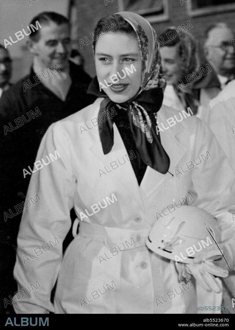 Princess Goes Down A Mine - H.R.H. Princess Margaret carrying miner's helmet, photographed after ascending from the pit at Calverton Colliery, Nottinghamshire.
On Wednesday April 7th, H.R.H. Princess Margaret descended the  Calverton Coal-mine, Nottinghamshire, one of the most modern in Britain, at her own request. Wearing a white overall and with a miner's helmet
over her gaily-coloured head-scarf, the Princess inspected the colliery and saw miners using modern electrical coal-cutting machines at the coal-face.
Her Royal Highness "mined" herself a piece of coal as a souvenir, with a pick. April 07, 1954. (Photo by Paul Popper Ltd.).