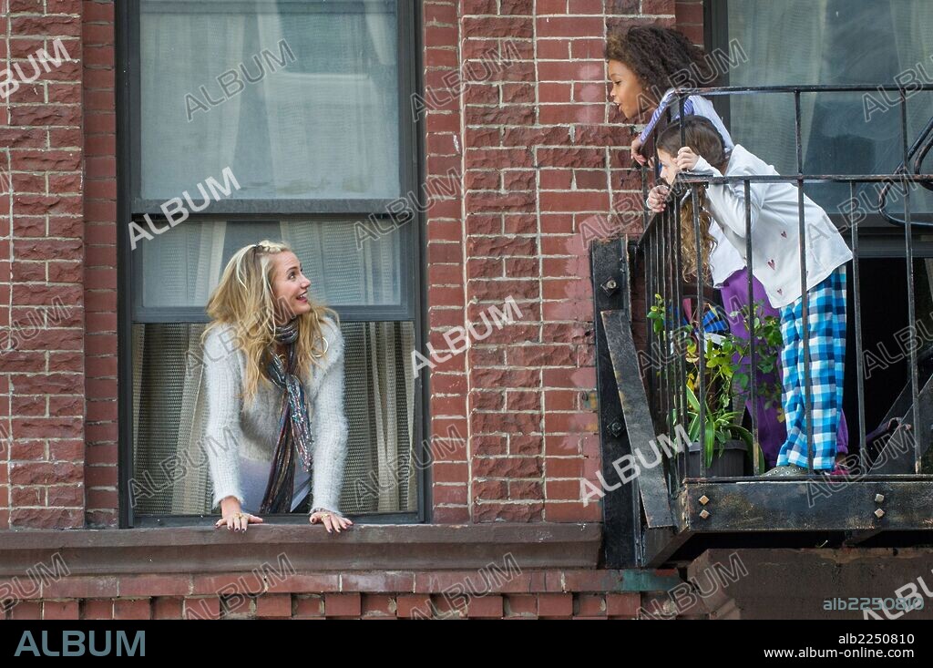 CAMERON DIAZ and QUVENZHANE WALLIS in ANNIE, 2014, directed by WILL GLUCK. Copyright SONY PICTURES ENTERTAINMENT.