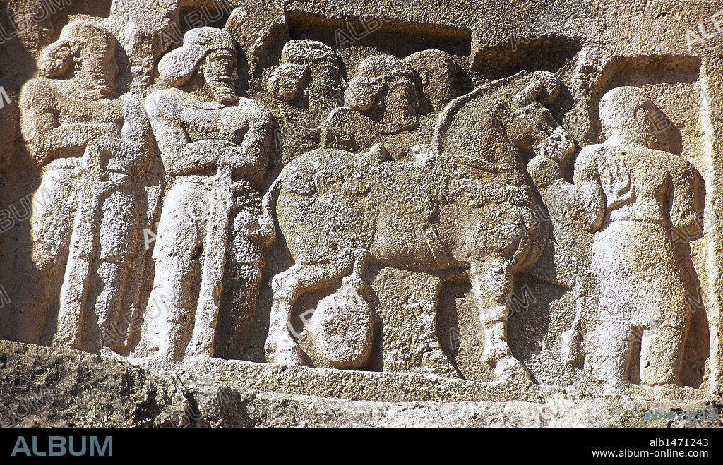 Sassanian rock relief, ca, 350 AD. Relief VI. The victory of King Shapur II (r. 309-379). Detail. Soldiers next to a horse. Bishapur, Fars Province, Iran. (Old Persia).