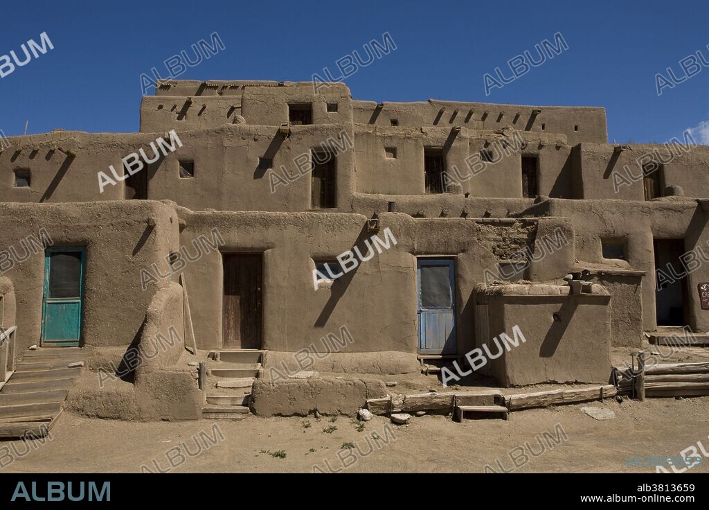 Taos Pueblo in New Mexico. Taos Pueblo is the only living Native American community designated both a World Heritage Site by UNESCO and a National Historic Landmark. The multi-storied adobe buildings have been continuously inhabited for over 1000 years.