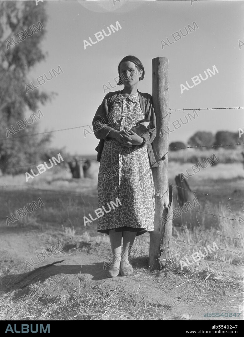 DOROTHEA LANGE. Pregnant migrant woman living in California squatter camp. Kern County.