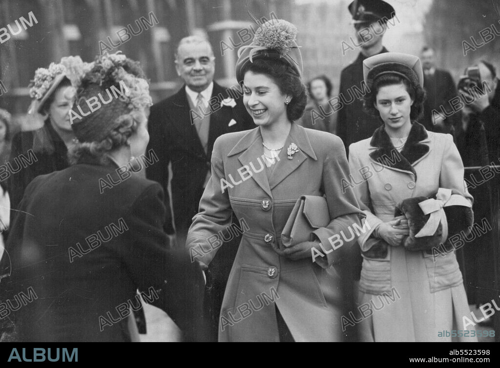 Crinoline Wedding -- Saying good-bye at the church. H.R.H. Princess Elizabeth and carrying a muff, H.R.H. Princess Margaret are bade farewell at St. Margaret's after the wedding to-day (Tuesday).It was a white and ***** occasion at St. Margaret's ***** Westminster, to-day (Tuesday) when the Hon. Sarah Ismay, second daughter of General Lord Ismay and Lady Ismay, was marrie to Flight Lieutenant5 the Hon. Wentworth Beaumont, son of Viscount Allendale, and ADC to Earl Mountbatten. The bride's wedding gown - by Hardy Amies - is unusual. February 10, 1948.