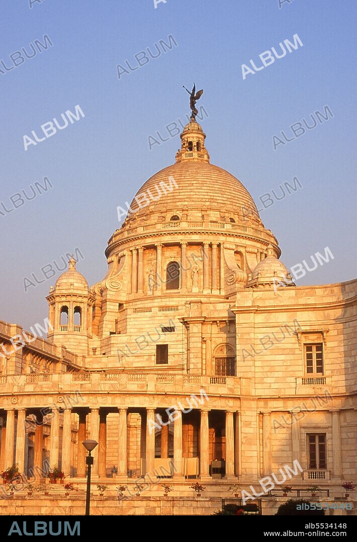 The Victoria Memorial Hall was built between 1906 and 1921 and is dedicated to the memory of Queen Victoria (1819–1901), Empress of India. The memorial was built in an Indo-Saracenic revivalist style and the architect was William Emerson (1843 - 1924). The tax records of Mughal Emperor Akbar (1584–1598) as well as the work of a 15th century Bengali poet, Bipradaas, both mention a settlement named Kalikata (thought to mean ‘Steps of Kali’ for the Hindu goddess Kali) from which the name Calcutta is believed to derive. In 1690 Job Charnock, an agent of the East India Company, founded the first modern settlement in this location. In 1698 the company purchased the three villages of Sutanuti, Kolikata and Gobindapur. In 1727 the Calcutta Municipal Corporation was formed and the city’s first mayor was appointed. In 1756 the Nawab of Bengal, Siraj ud-Daulah, seized Calcutta and renamed the city Alinagar. He lost control of the city within a year and Calcutta was transferred back to British control. In 1772 Calcutta became the capital of British India on the orders of Governor Warren Hastings. In 1912 the capital was transferred to New Delhi while Calcutta remained the capital of Bengal. Since independence and partition it has remained the capital and chief city of Indian West Bengal.