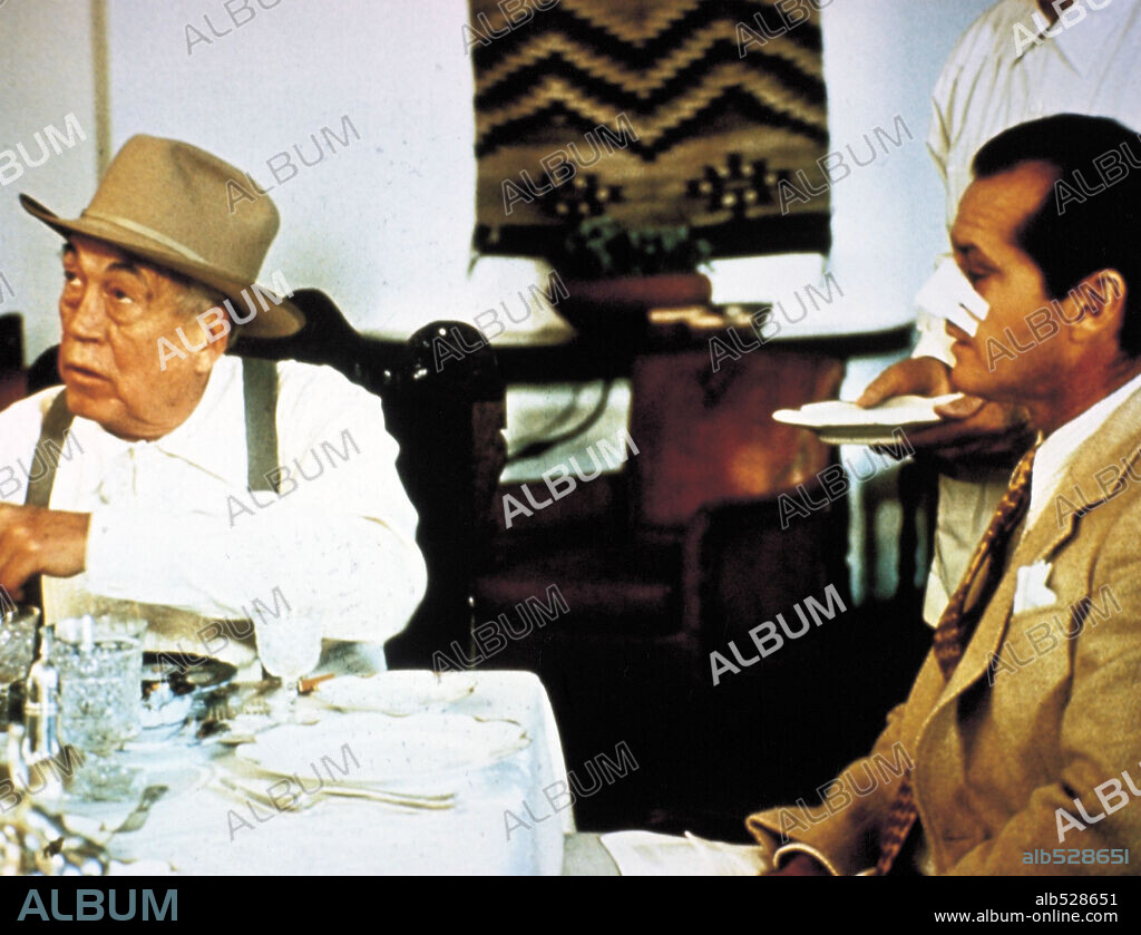 JACK NICHOLSON and JOHN HUSTON in CHINATOWN, 1974, directed by ROMAN POLANSKI. Copyright PARAMOUNT PICTURES.