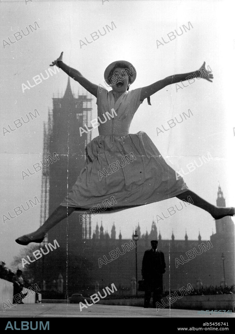 Actress and singer Louie Ramsay, 25, who usually has to play "glamour girl" parts in  her stage shows, is jumping for joy - because in her new London musical she plays the part of an "ordinary" girl. She is a typist who catches the 7.27 train to the city every week-day morning. Louis says: "I was a bit tired of being one of the easy on the eye types. Being ordinary is fun". May 27, 1955.