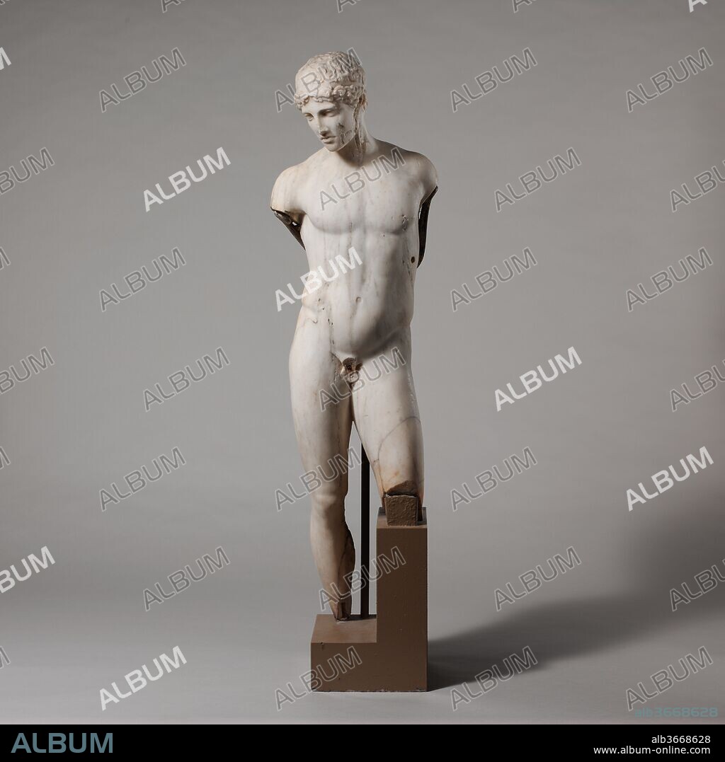 Marble statue of a youth. Culture: Roman. Dimensions: H. 45 3/4 in. (116.2 cm). Date: 1st century A.D..
Roman copy of Greek original. Adaptation of a Greek statue type of the late
5th century B.C.
The pose of this statue probably derives from a Classical Greek bronze erected to commemorate the victory of a young athlete. With its sinuous grace, it became an appealing decorative work in this Roman adaptation in marble. All the statues on view in this central courtyard are Roman copies or variations on statue types created some four or five hundred years earlier, during the late Classical or Hellenistic period. While most of the original works were dedications set up in religious sanctuaries, the Roman versions were used primarily to decorate the rooms and gardens of private villas as well as the theaters and public baths that were important features of every Roman city.