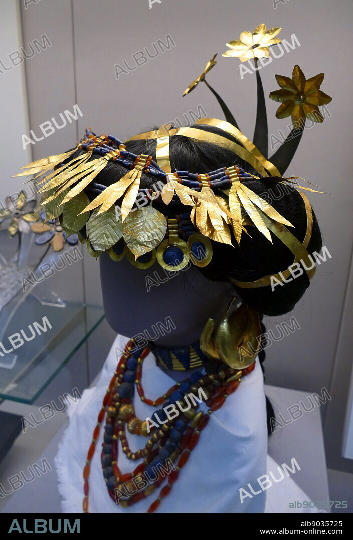 Reconstructed headdress of Puabi, by Sir Charles Leonard Woolley, found at the Sumerian city of Ur, in Iraq. Dates from the First Dynasty of Ur (ca. 2600 BC). Commonly labelled as a "queen", her status is somewhat in dispute. Several cylinder seals in her tomb identify her by the title "nin" or "eresh", a Sumerian word which can denote a queen or a priestess.