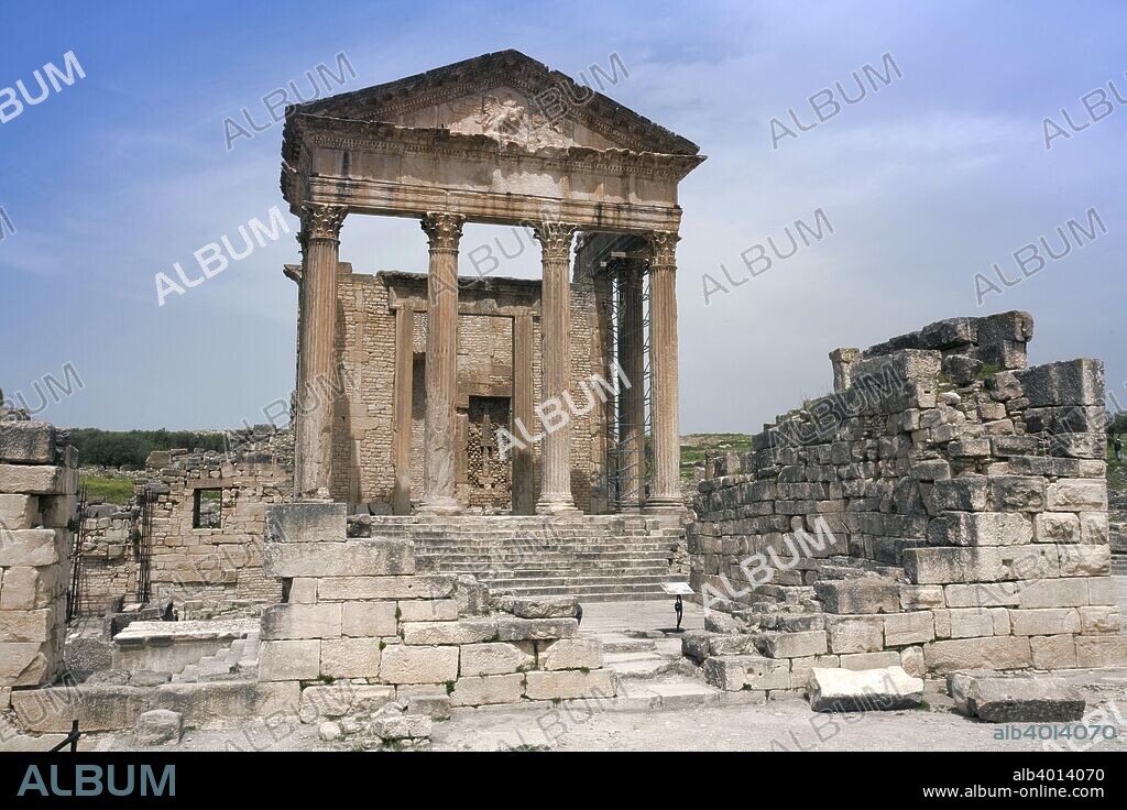The Capitolium at Dougga (Thugga), Tunisia. Between the Place de la Rose des Vents and the Forum in Dougga, on a high base, stands the Capitolium, a temple dedicated to the Capitoline triad of Jupiter, Juno and Minerva. Built in AD 166 or 167, it is one of the finest and best preserved Roman temples in North Africa.