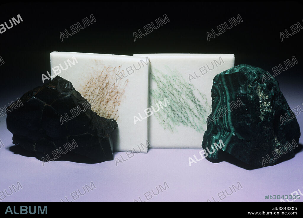 Streak is the color of a mineral powder. In many cases the apparent body color of a mineral is very different from its powder. Black hematite (left in photo) has a red streak. The green streak of malachite (right), however, is similar to its body color. A 'streak plate' is a hard porcelain tile that mineralogists typically use to create a powder when a mineral specimen is rubbed against it.