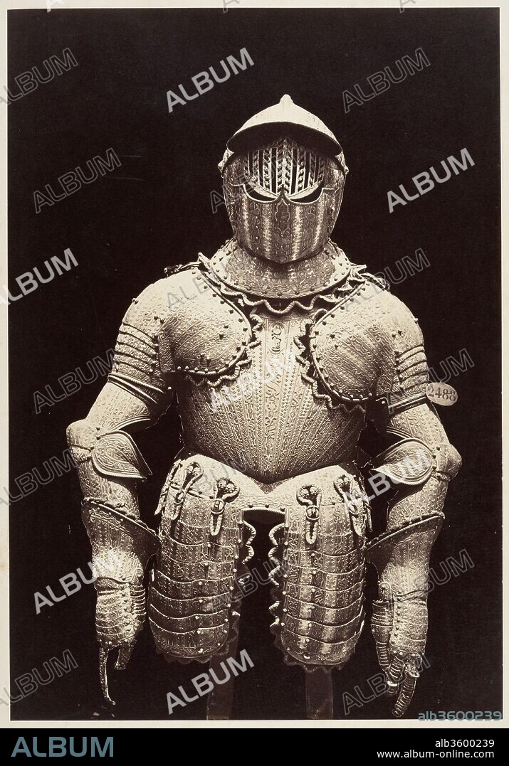 [The Armor of Philip III]. Artist: Charles Clifford (Welsh, 1819-1863). Dimensions: Image: 33.3 x 23 cm (13 1/8 x 9 1/16 in.)
Mount: 57.2 x 45.7 cm (22 1/2 x 18 in.). Date: 1866.
For a sixteenth-century nobleman, a finely decorated suit of armor was indispensable. The suit defined one's social standing, confirmed the refinement of one's taste, and made it publicly clear that the bearer was the nominal head of an army.
This striking photograph was previously believed to be a work by Charles Clifford, the official photographer to Queen Isabella II and the greatest photographer practicing in Spain in the mid-nineteenth century. It is now known to be a photograph made after his death by an equally accomplished artist, his wife Jane Clifford. Likewise, the subject was originally recorded, in period hand on this print's mount, as the armor of Christopher Columbus. In fact, the suit dates from a different historical period; it was a gift from the city of Pamplona to Philip III (1578-1621), King of Spain and Portugal from 1598 until his death. Although we do not yet know for what purpose Jane Clifford documented the highlights in the collection of the Armería Real (the Royal Armory in Madrid), it is clear that the heavy cavalry armor, with its marvelous bands of decoration encrusted with gold and silver, is a sight to behold. If the helmet looks peculiar it is because part of the gated inner visor is not fully lowered.