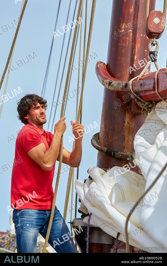 Sailor. Ropes sail of a sailboat, galleon. Basque Country. Spain.