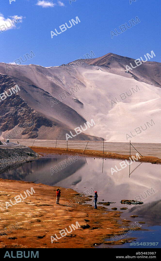 The Pamir Mountains are a mountain range in Central Asia formed by the junction or knot of the Himalayas, Tian Shan, Karakoram, Kunlun, and Hindu Kush ranges. They are among the world’s highest mountains and since Victorian times they have been known as the 'Roof of the World' a probable translation from the Persian. The Zhongba Gonglu or Karakoram Highway is an engineering marvel that was opened in 1986 and remains the highest paved road in the world. It connects China and Pakistan across the Karakoram mountain range, through the Khunjerab Pass, at an altitude of 4,693 m/15,397 ft.
