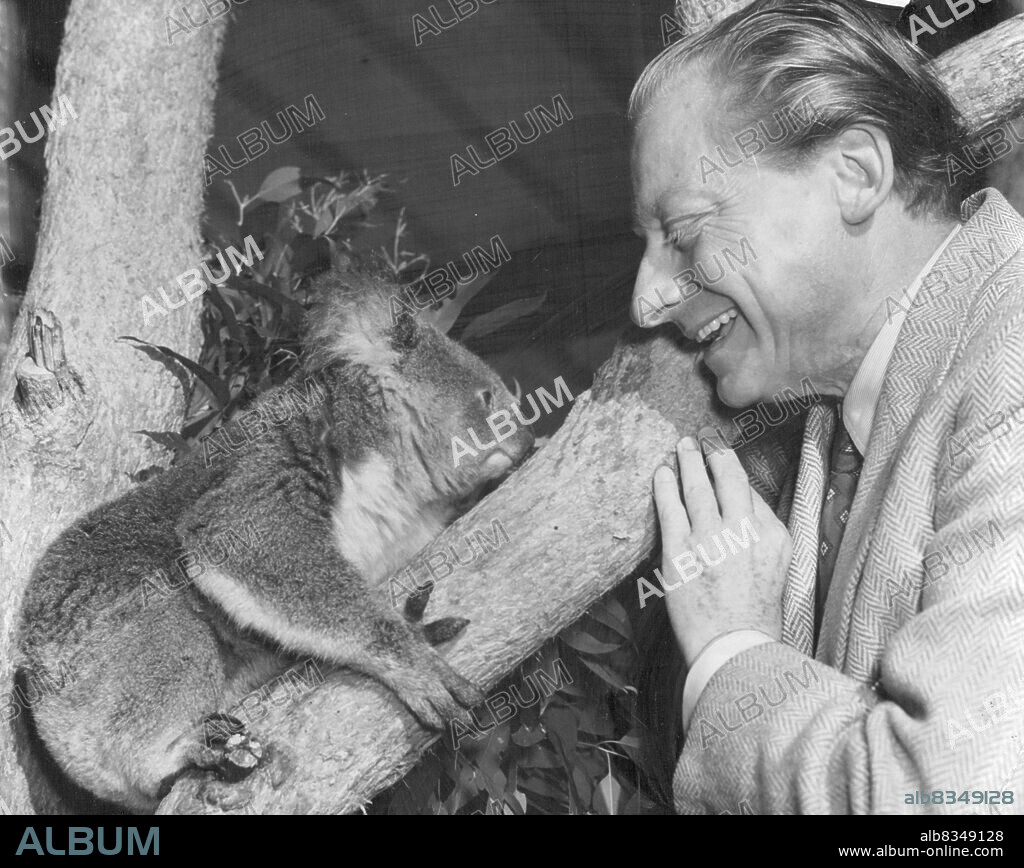 Dr. Hans Schmidt-Isserstedt, German conductor tonight Australia for the A. B.C. Miss friends with with a *****. July 30, 1953. (Photo by Peter Leyden).