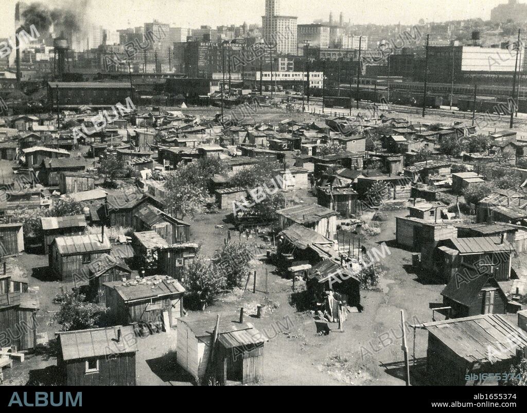 The American Depression 1930s: Thousands of jobless lived in shanty towns nicknamed 'Hoovervilles', earning a few cents a day sorting bottles and cans. This 'Hooverville' was located near the waterfront in Seattle.