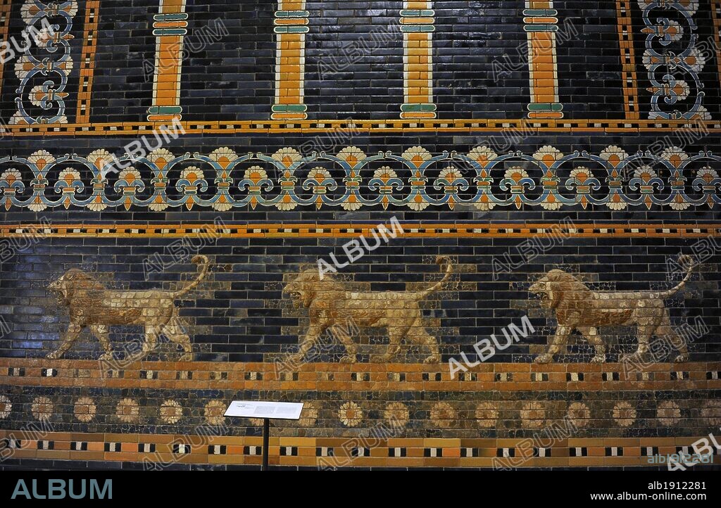Mesopotamian art. Neo-Babylonian. The Throne Room of  Nebuchadnezzar II. Reconstructed facade. Dated in 580 B.C. Its 56 meters facade was decorated with colored glazed bricks as shows the composition, including stylized palms. The frieze of lions was presumably arranged symmetrically so that the animals faced toward the central main entrance to the trone-room. Detail. Pergamon Museum. Berlin. Germany.