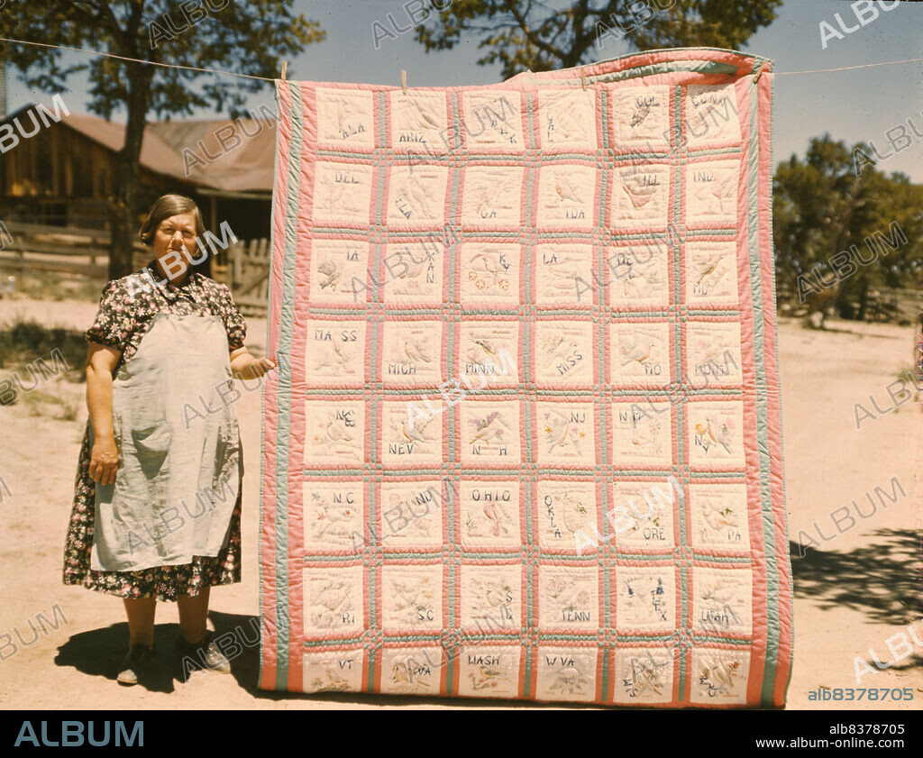 RUSSELL LEE. Mrs. Bill Stagg with state quilt that she made, Pie Town, New Mexico. A community settled by about 200 migrant Texas and Oklahoma farmers who filed homestead claims ... Mrs. Stagg helps her husband in the field with plowing planting, weeding corn and harvesting beans. She quilts while she rests during the noon hour.