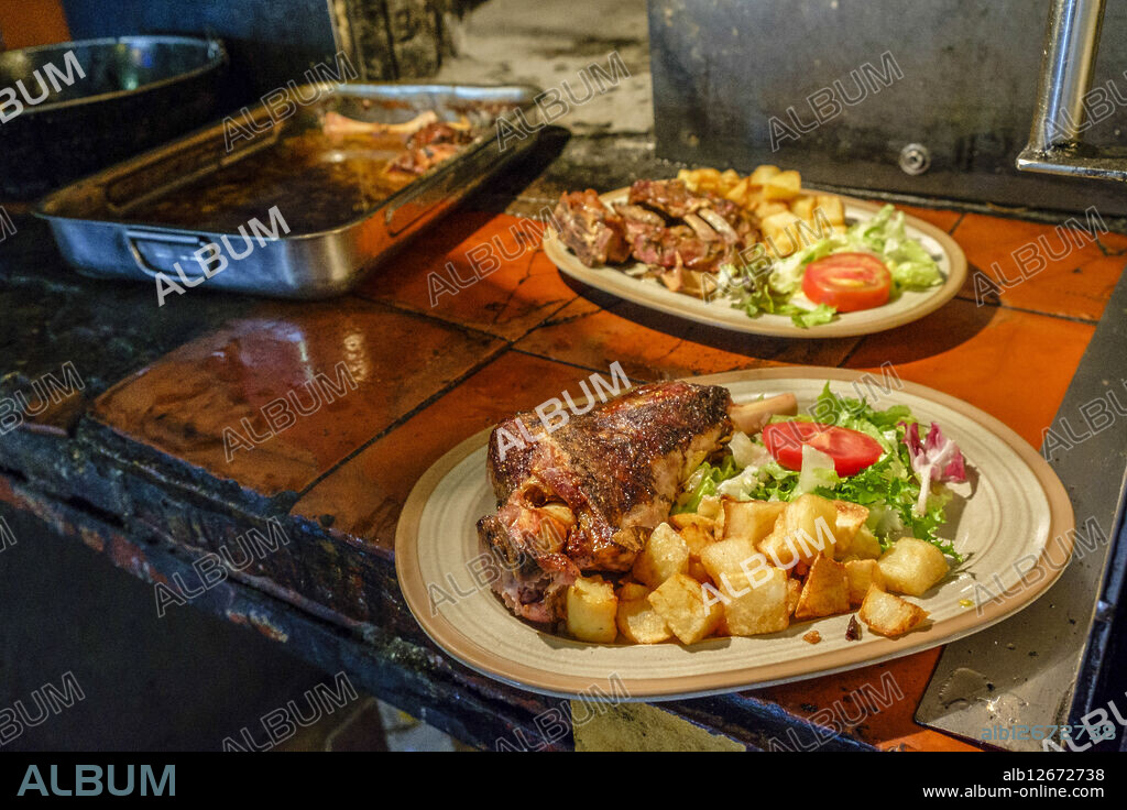 lamb and kid in traditional wood oven, restaurant Es Verger, puig de Alaró, comarca of Raiguer, Mallorca, balearic islands, spain, europe.