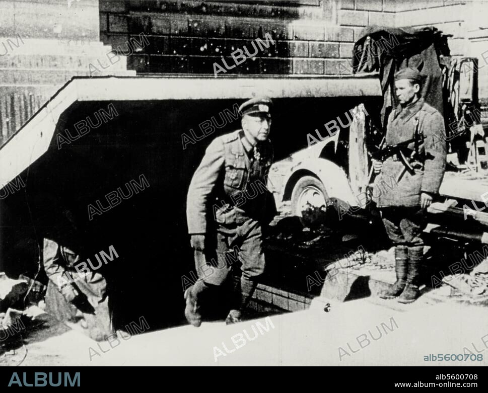 Berlin, after the capitulation on 2 May. 1945 / German officers are led through destroyed Berlin as prisoners of war, 6th May 1945. / - The Berlin Stadtkommandant Gen. Helmuth Weidling leaving the Reichs chancellory bunker from the Vossstrasse side. Photograph given the title "Weidling taken prisoner on 2 May". by Russian propagandists).