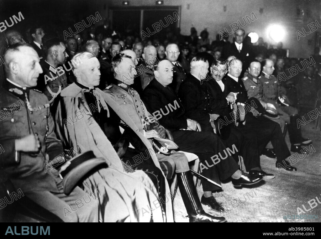 Inauguration of the 'New Europe Exposition', Paris, 30 May 1941. Among the dignitaries attending are German General von Barkhausen (left), Cardinal Suhard, Archbishop of Paris (2nd left), Vichy ambassador to the German High Command in Paris Fernand de Brinon (4th from left) and Pierre Laval, vice-premier of Vichy France (6th from left).