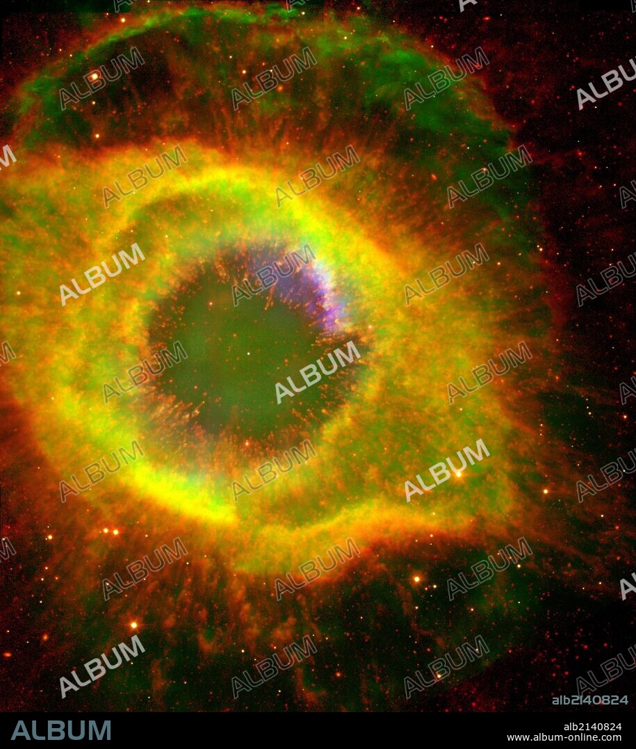 Six hundred and fifty light-years away in the constellation Aquarius, a dead star about the size of Earth, is refusing to fade away peacefully. In death, it is spewing out massive amounts of hot gas and intense ultraviolet radiation, creating a spectacular object called a "planetary nebula." Hubble Space Telescope (HST), Spitzer Space Telescope.  (Photo by: Universal History Archive/UIG via Getty Images).