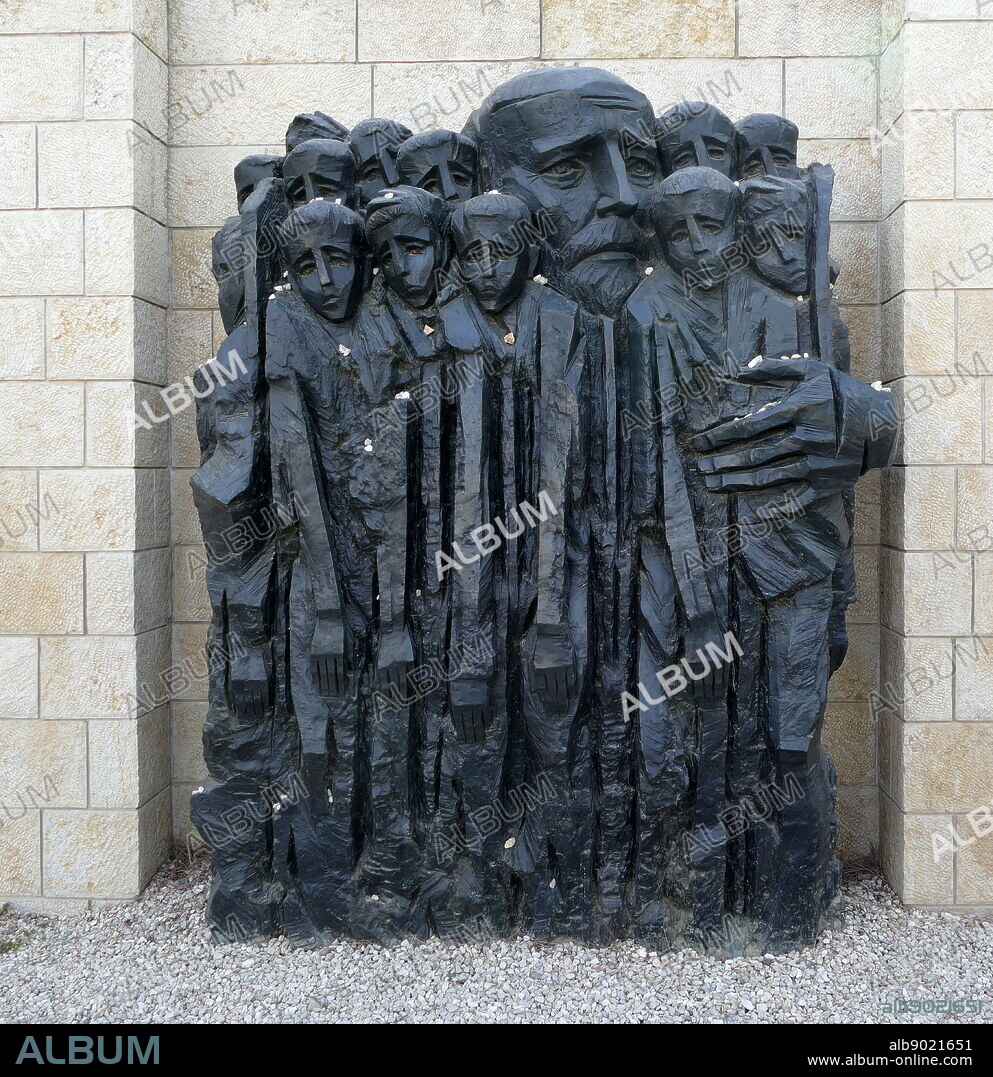 Janusz Korczak & the Children of the Ghetto,' Janusz Korczak Square, Yad Vashem Holocaust Memorial, Jerusalem (Israel). Sculpture by Boris Saktsier, depicts the Polish-Jewish educator Dr. Henrik Goldschmidt [1878-1942] (known by his pseudonym Janusz Korczak), as he stands in the center of a group of children and shelters them with his body and his outstretched, embracing arms. Janusz Korczak & the children of his orphanage were sent to the Treblinka death camp on August 5, 1942.