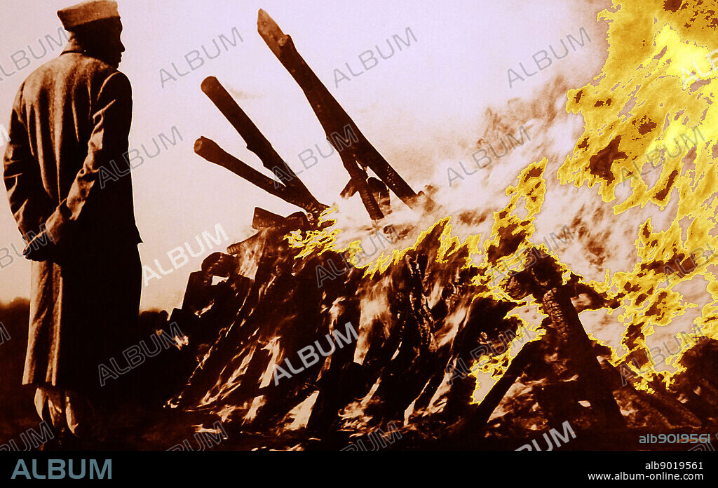 Indian Prime Minister Jawaharlal Nehru watches the cremation of Mohandas Karamchand Gandhi 1869 1948) at his cremation following his assassination in 1948. Gandhi was the preeminent leader of the Indian independence movement in British-ruled India. At 5:17 pm on 30 January 1948, Gandhi was with his grandnieces in the garden of the former Birla House (now Gandhi Smriti), on his way to address a prayer meeting, when Nathuram Godse fired three bullets from a Beretta 9 mm pistol into his chest at point-blank range.
