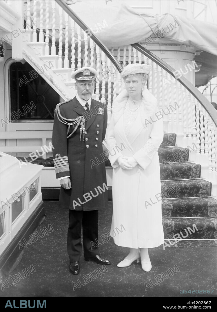 King George V and Queen Mary aboard 'HMY Victoria and Albert', 1935. King George V (1865-1936) in naval uniform, and Queen Mary (1867-1953) on board the royal yacht. 'HMY Victoria and Albert', launched in 1899, was a steamship used by the royal family, particularly for their trips to their summer home, Osborne House, on the Isle of Wight.