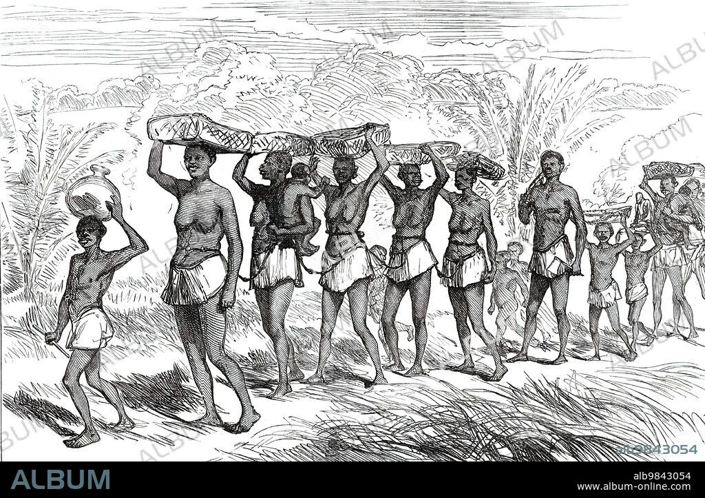 Slave Gang passing along the edge of the Lushivi Marsh, from a sketch by Lieutenant Cameron in Central Africa, 1876. 'The painful march of a slave gang, two or three score wretched women all tied together by knotted ropes, all heavily laden and driven on by the whip, is a very sad scene for the humane spectator to behold'. From "Illustrated London News", 1876.