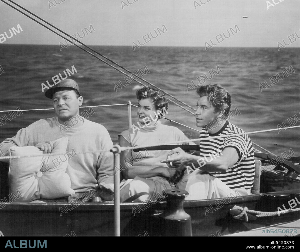 Seasick...Esther Williams and Fernando Lamas are amused at Jack Carson's professed mastery of the sea in this scene from M-G-M's "Dangerous When Wet". Miss Williams, Lamas,Carson, Charlotte Greenwood and Denise Darcel co-star in the Technicolor musical story of an American girl who swims the English Channel -- and finds romance. Charles Walters directed and George Wells produced. October 26, 1953.