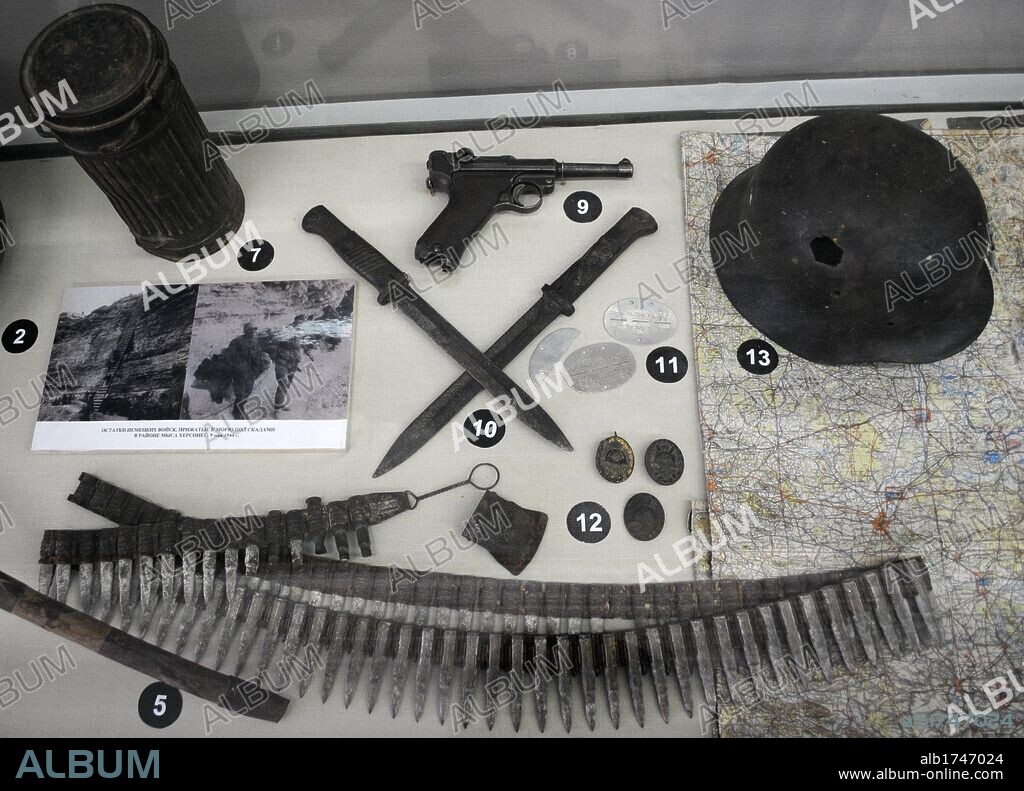 Showcase with material and weapons used by soldiers during World War II. Black Sea Fleet Museum. Sevastopol. Ukraine.
