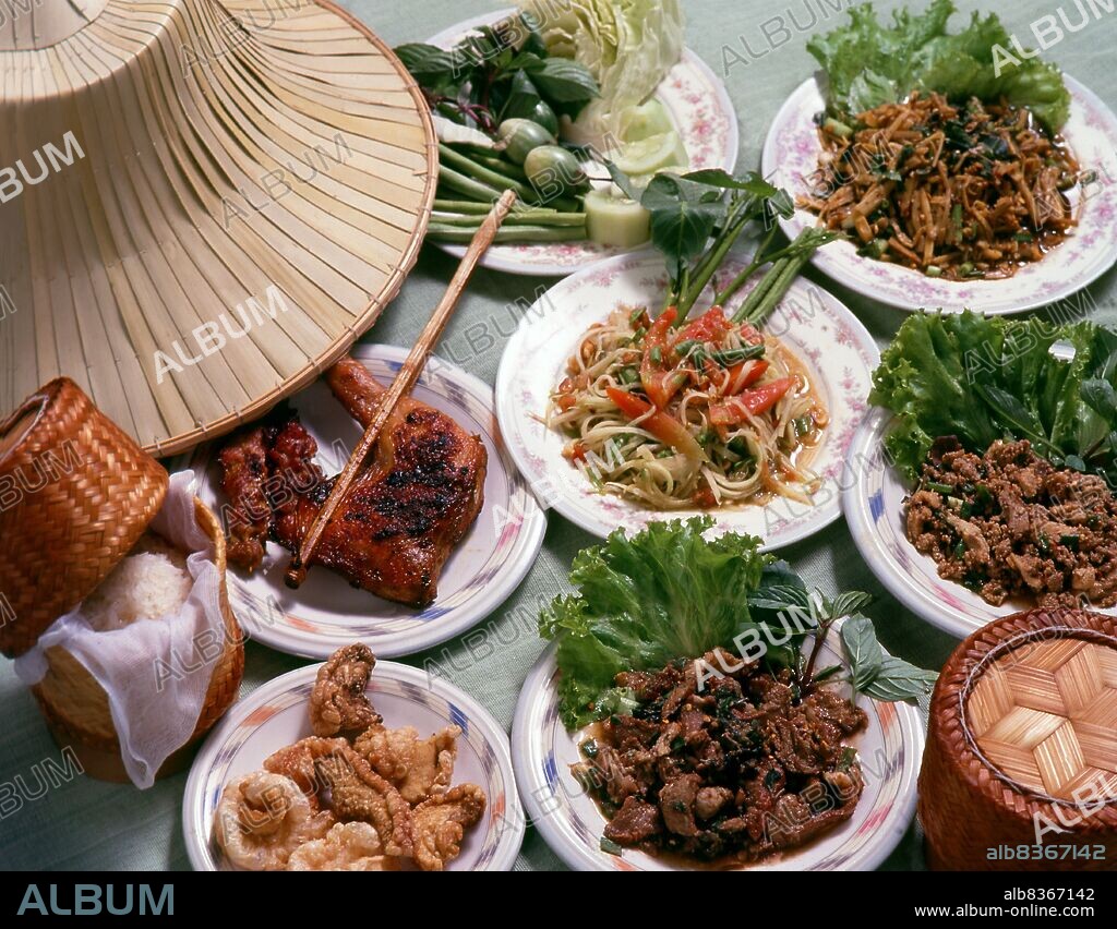 Northeastern Thai and Lao food is generally of the simple, spicy, peasant variety enjoyed by the inhabitants of this relatively poor region. The most famous dishes include <i>somtam</i> papaya salad with fish sauce, garlic, chilli peppers, peanuts and <i>puu na</i> field crab added to taste. This is often eaten with <i>kai yang</i> grilled chicken, the best of which is said to come from Sisaket, close to the Lao frontier.<br/><br/>. Perhaps the most classic of Isaan dishes is <i>larb</i> spiced minced meat generally served with salad and a side plate of raw vegetables. Unlike Bangkok and the South, <i>khao niaw</i>, or 'sticky rice' a glutinous variant served in small woven bamboo baskets and eaten with the hand is the main accompaniment to every meal.