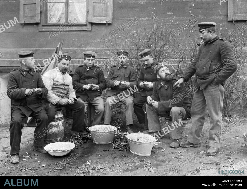 Germany: c. 1915 German Landsturm troops peeling potatoes.
