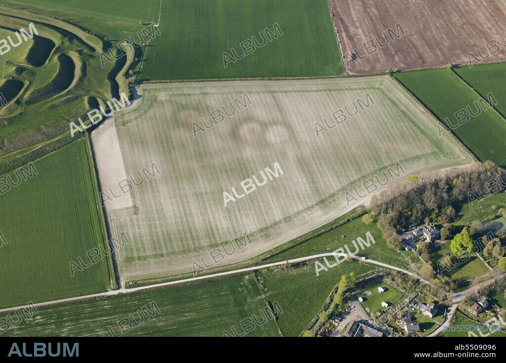 HISTORIC ENGLAND. A round barrow cemetery crop mark immediately south east of Maiden Castle, Winterborne Monkton, Dorset, 2015.