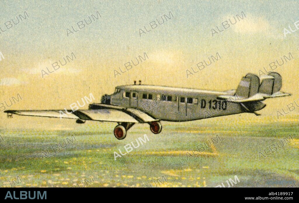 Junkers G 31b plane, 1920s, (1932). The Junkers G 31 advanced tri-motor airliner was produced in Germany in the 1920s. Like other Junkers types, it was an all-metal, low-wing cantilever monoplane. From "Die Eroberung Der Luft", (The Conquest of the Air), cigarette card album produced by the Garbáty cigarette factory, 1932. Eugene and Moritz Garbáty, who were Jewish, were driven out of business by the Nazis in the late 1930s, and forced to sell their factory which lay empty for over 70 years. [Garbaty Cigarettenfabrik, Berlin-Pankow, 1932].