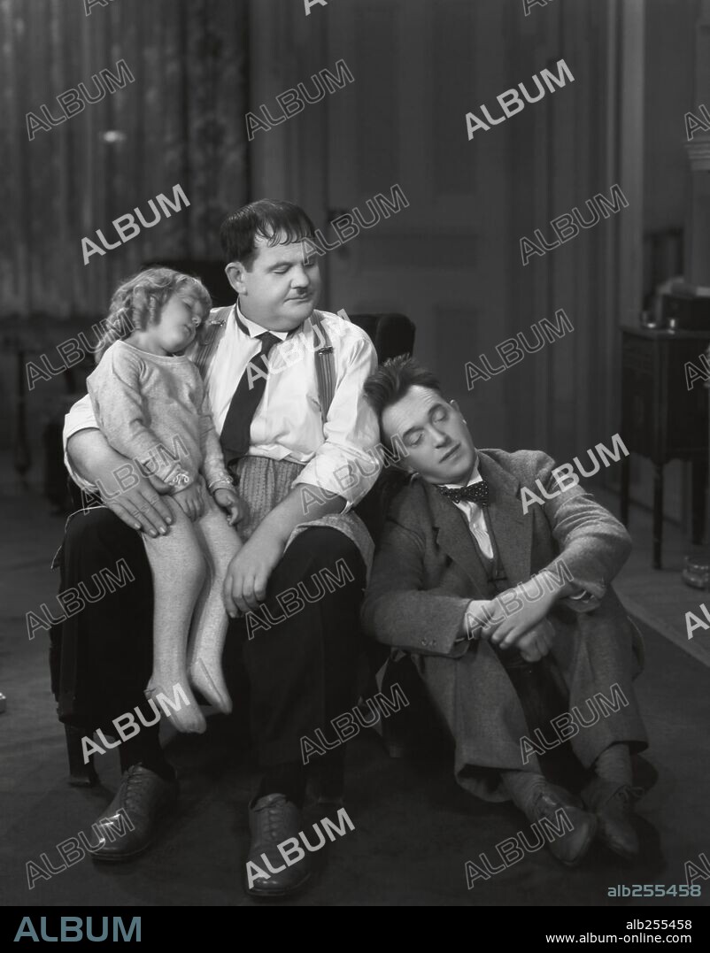 JACQUIE LYN, OLIVER HARDY and STAN LAUREL in PACK UP YOUR TROUBLES, 1932, directed by GEORGE MARSHALL. Copyright HAL ROACH/MGM.