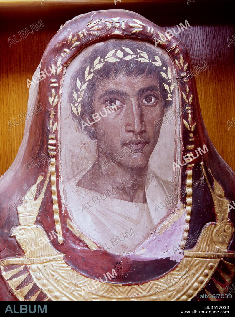Mummy case and portrait of Artemidorus, from Hawara, Egypt, Roman Period, c100-c120. The mummified body is enclosed in a red-painted stucco casing. A portrait panel has been inserted at the head of the case. It is painted in encaustic, a mixture of pigment and beeswax with a hardening agent such as resin or egg. Below the portrait is a falcon-collar and a series of traditional Egyptian funerary scenes applied in gold leaf. The identity of the dead man is preserved in a short, mis-spelled Greek inscription across the breast, which reads: 'Farewell, Artemidorus'. This mummy represents an excellent example of the merging of cultural influences: a Greek personal name, a Roman-style portrait, together with traditional Egyptian funerary practices. CT scans have been made of Artemidorus' mummy. There is evidence of damage to the bones in the area of the nose, and cracks to the back of the skull. Interestingly, there are no signs of healing. While it is possible that the damage is a result of rough treatment when the body was being mummified, the injuries may have been the result of an assault and may have even been the cause of death. Artemidorus was probably between 18 and 21 when he died, which is in keeping with the age suggested by the mummy's portrait.