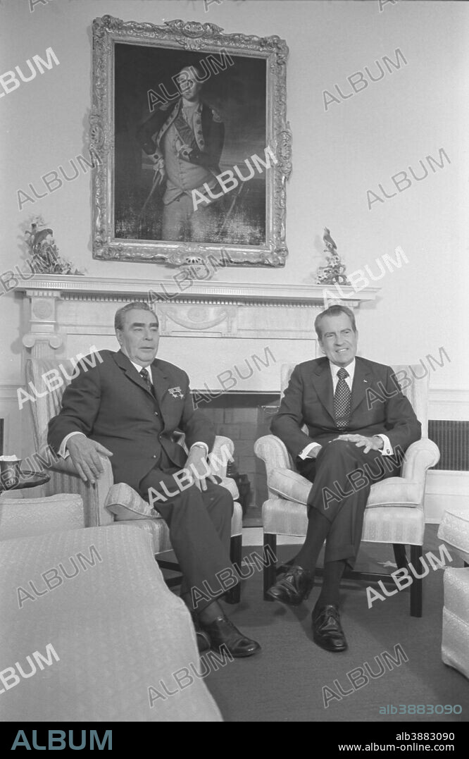 June 18, 1973 - President Richard Nixon and Soviet leader Leonid Brezhnev seated in the White House, portrait of George Washington in the background.